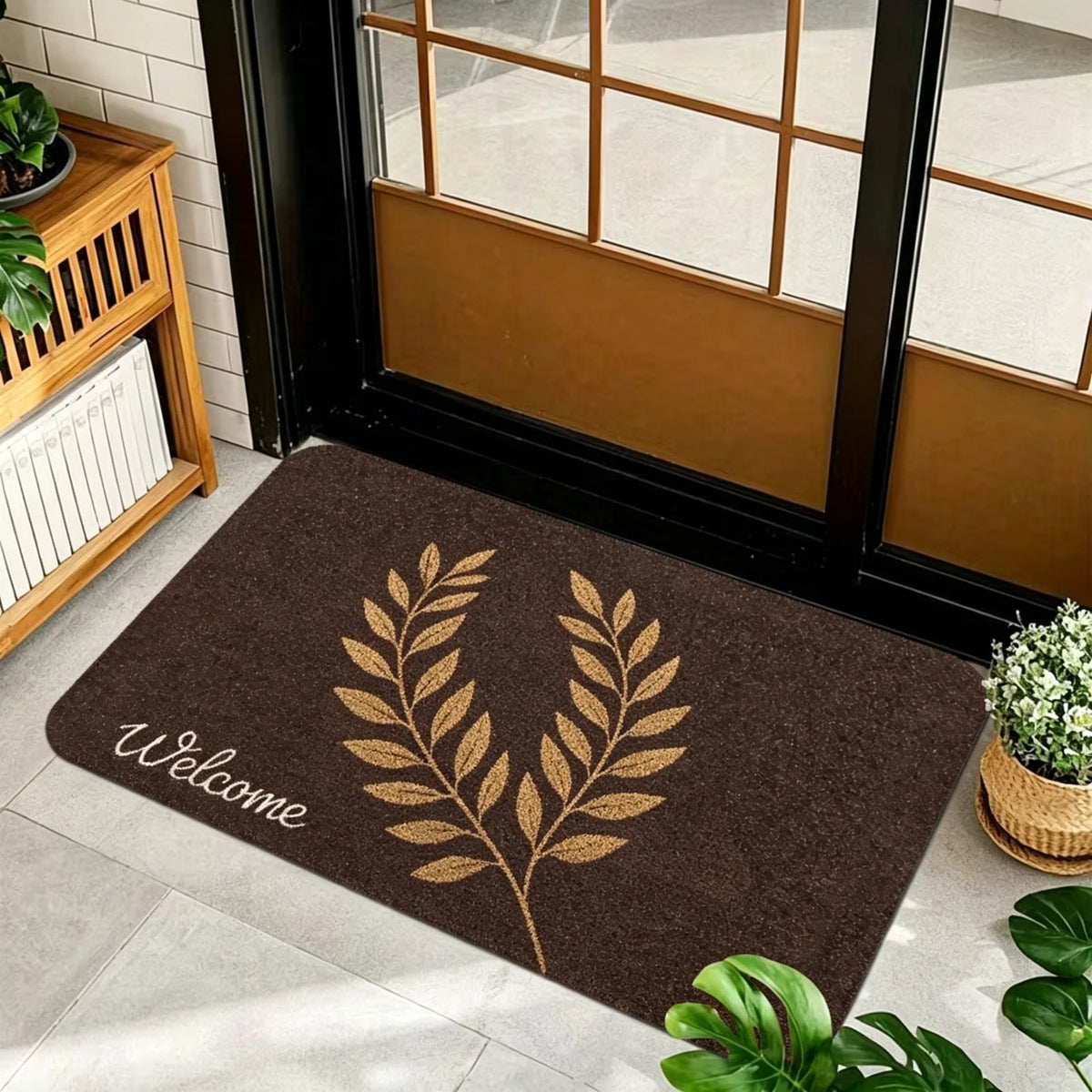 1 Piece, Dark Brown Base Flannel Floor Mat with Elegant Retro Style Gold, White, and Brown Ginkgo Leaf Patterns, with a Delicate and Eye-Catching White Grass Sign 'Welcome' on the Left. the Perfect Fusion of Natural Elements