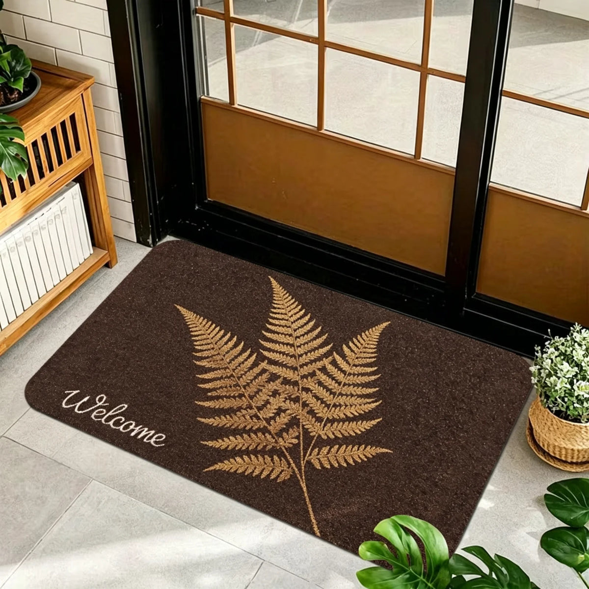 1 Piece, Dark Brown Base Flannel Floor Mat with Elegant Retro Style Gold, White, and Brown Ginkgo Leaf Patterns, with a Delicate and Eye-Catching White Grass Sign 'Welcome' on the Left. the Perfect Fusion of Natural Elements