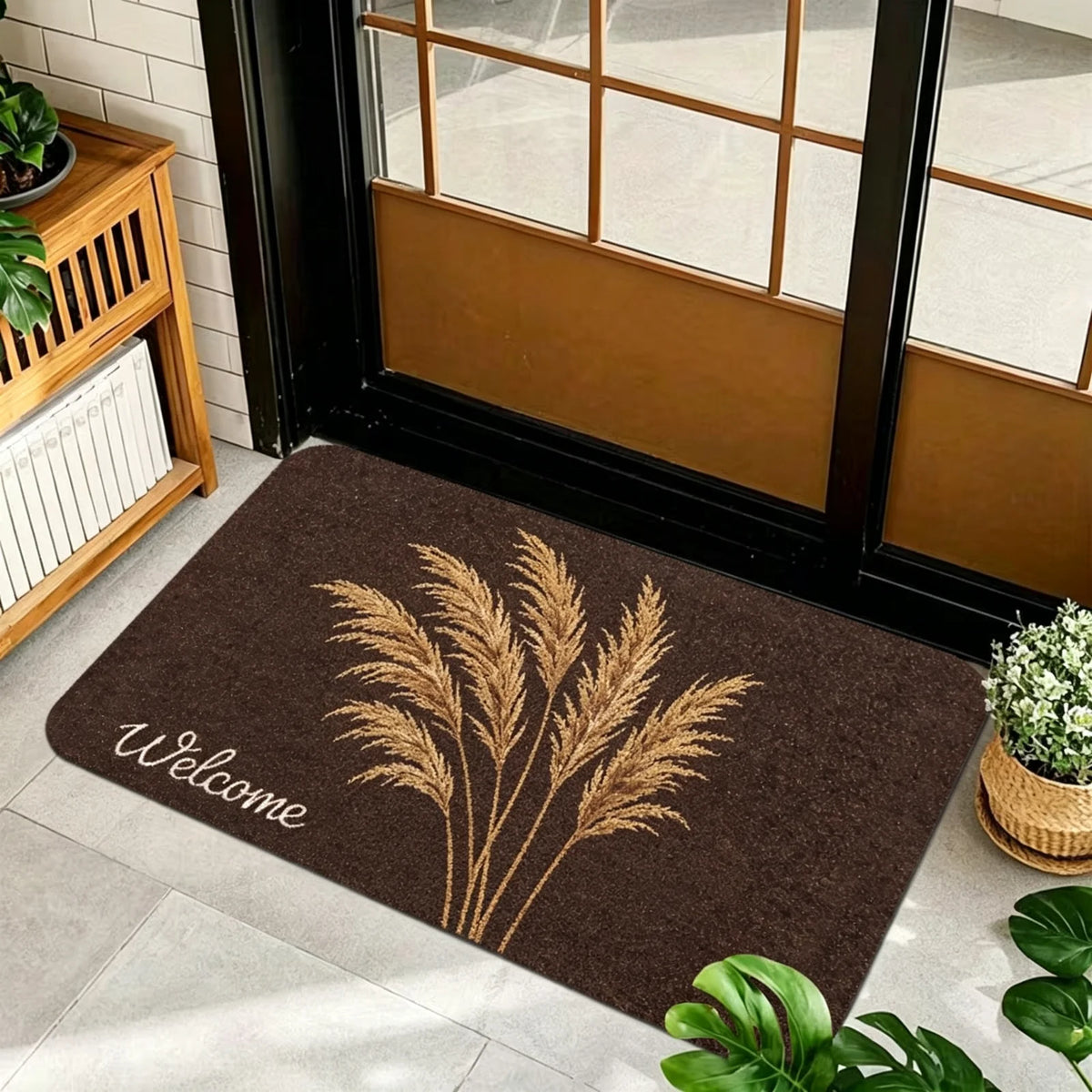 1 Piece, Dark Brown Base Flannel Floor Mat with Elegant Retro Style Gold, White, and Brown Ginkgo Leaf Patterns, with a Delicate and Eye-Catching White Grass Sign 'Welcome' on the Left. the Perfect Fusion of Natural Elements